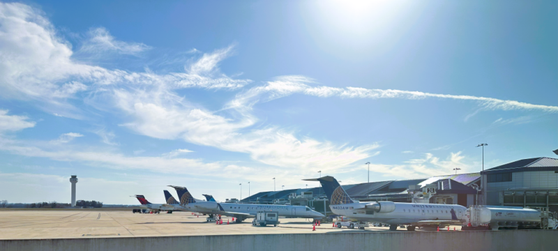 Five airplanes line up at the Huntsville International Airport terminal.