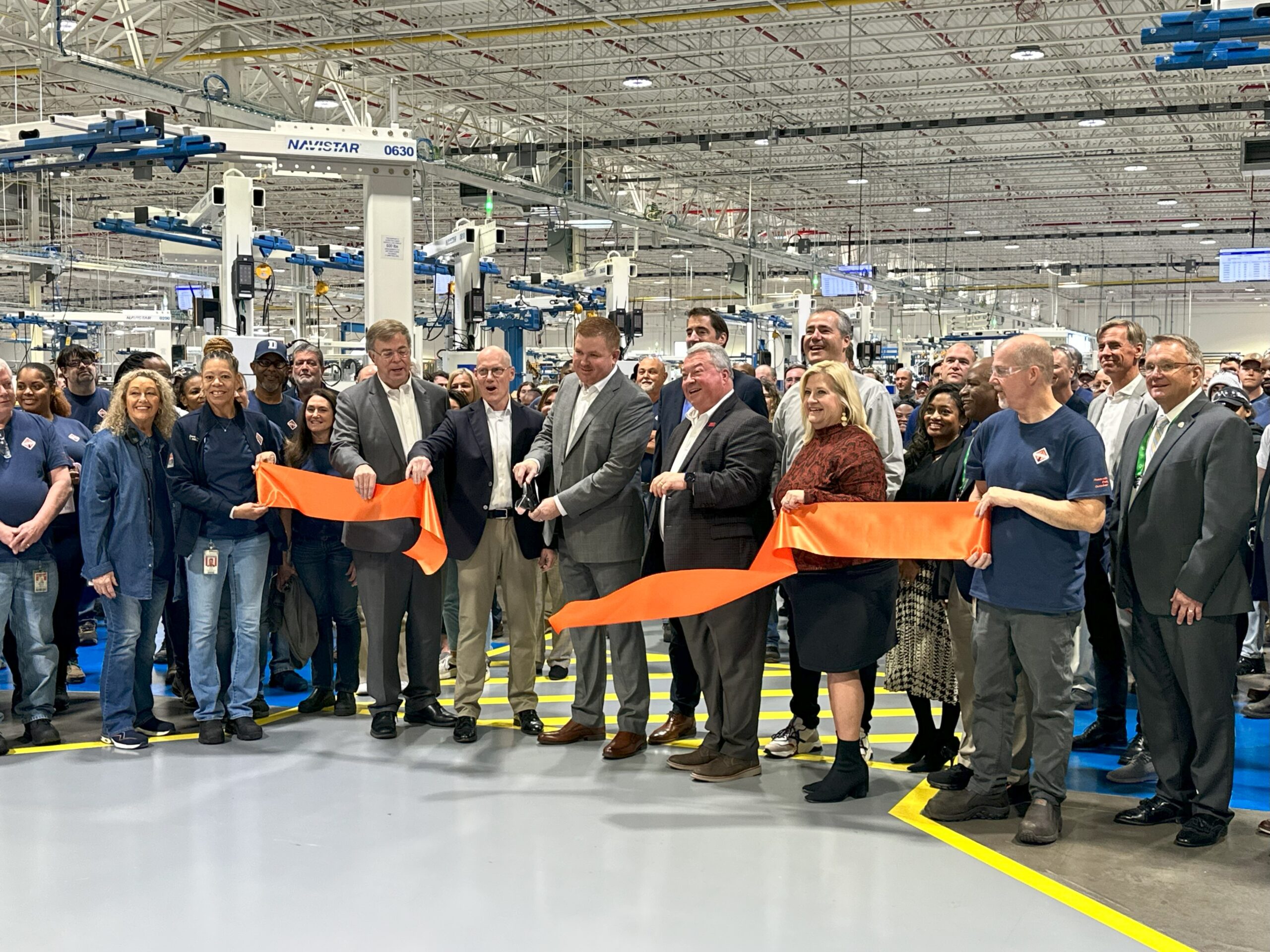 Community leaders cut the ribbon at the Navistar engine plant at Huntsville International Airport.